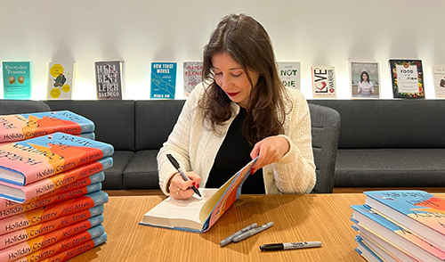 Inci Atrek signing copies of Holiday Country